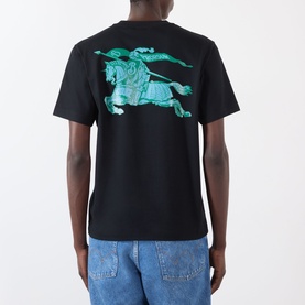 Model wearing Burberry Ryan Big Logo T-Shirt in black, back view showing large green Equestrian Knight graphic, styled with light blue jeans.