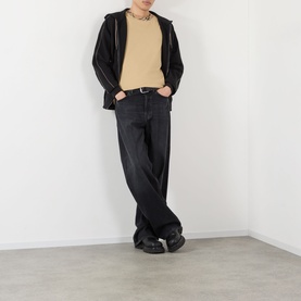 Model wearing Burberry Ryan Check-Collar T-Shirt in sand, styled with dark wash wide-leg jeans, black zip jacket and black chunky shoes.