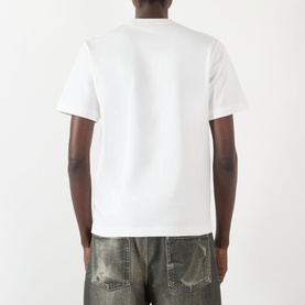 Model wearing Burberry Seth Embroidered Logo T-Shirt in white, rear view, crew neck, short sleeves, styled with distressed khaki jeans.