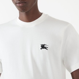 Model wearing Burberry Seth Embroidered Logo T-Shirt in white, featuring black EKG chest emblem on crew neck cotton tee.