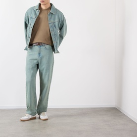 Model wearing Burberry Seth Check Piping T-Shirt in Finch Brown, styled with light blue denim jacket and trousers, white trainers.
