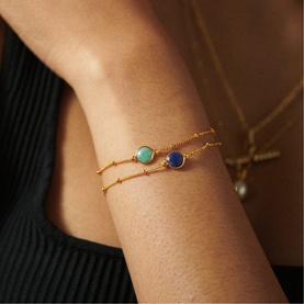 Model with Daisy Jewellery Healing Stone Bobble Bracelet in 18ct Gold Plate, featuring green amazonite and blue stone on adjustable bobble chain