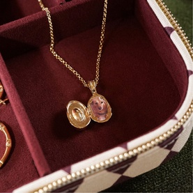 Daisy Jewellery Est&eacute;e Lalonde Sapphire Locket Necklace in 18ct gold plate, oval locket open revealing pink sapphire detail, gold chain