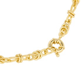 Model with Daisy Jewellery Polly Knot Chain Necklace in 18ct gold plate, bold knot links. Styled with matching gold earrings.