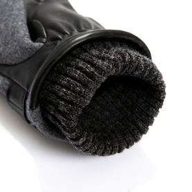 Dents charcoal and black leather gloves with ribbed knit cuff detail, close-up view showing texture and lining