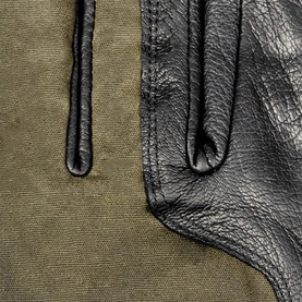 Dents Black/Olive leather and canvas gloves, close-up showing contrast textures and finger detail