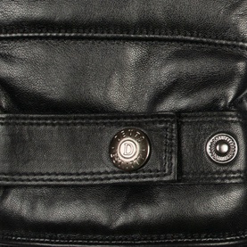 Dents black leather gloves close-up showing silver snap button fastening and smooth leather texture