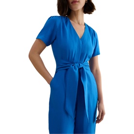 Model wearing Hobbs sapphire blue short-sleeve wrap-style dress with tie waist and V-neckline