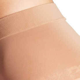 Falke Powder tights close-up showing sheer mesh fabric texture and wide comfort waistband in a neutral skin tone.