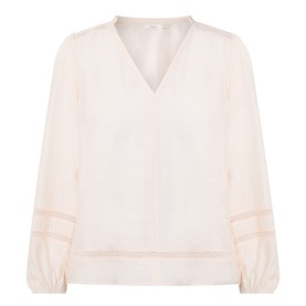 InWear vanilla blouse with V-neckline, balloon sleeves, and sheer lattice trim detail at cuffs and hem
