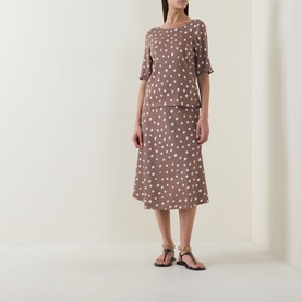 Model wearing InWear Henrii Polka Dot Blouse in Brown Bru with matching polka dot midi skirt and flat sandals.