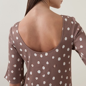 Model wearing InWear Henrii Polka Dot Blouse in Brown Bru, showing low-cut scoop back detail with white polka dot pattern