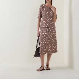 Model wearing InWear Henrii Polka Dot Blouse in Brown Bru with matching midi skirt, styled with black bag and flat sandals.