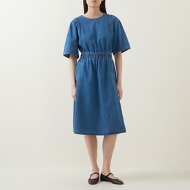Model wearing InWear Glenn Denim Dress in Faded Blue with elasticated waist, wide short sleeves and midi-length flared skirt, styled with black