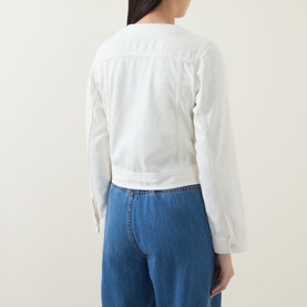 Model wearing InWear Gladys Zip Denim Jacket in Ecru Melange, collarless with long sleeves and buttoned cuffs, styled with blue wide-leg jeans. Back