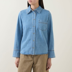 Model wearing InWear Bleach Denim shirt with classic collar, chest pocket, and button front, styled with beige trousers.