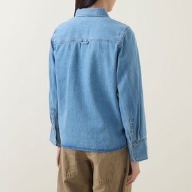 Model wearing InWear Bleach Denim shirt, back view, cotton-lyocell blend with button cuffs, styled with khaki trousers