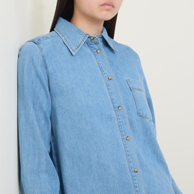Model wearing InWear Bleach Denim shirt with chest pocket and gold-tone snap buttons, relaxed fit in cotton-lyocell blend.