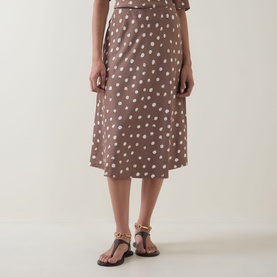 Model wearing InWear Brown Bru polka dot midi skirt in viscose, styled with gold chain sandals and matching top.