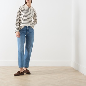 Model wearing InWear Vanilla Tri striped cotton polo T-shirt with blue straight-leg jeans and brown loafers.