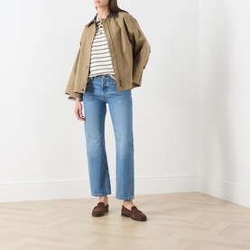 Model wearing InWear Vanilla Tri stripe cotton T-shirt, styled with tan jacket, blue straight-leg jeans and brown loafers.