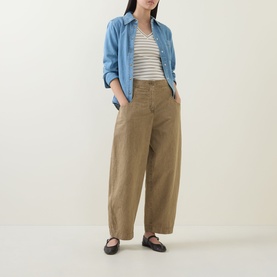 Model wearing InWear Dagnal Striped T-Shirt in Vanilla/Coffee Q, styled with a blue shirt, wide-leg khaki trousers and black ballet flats.