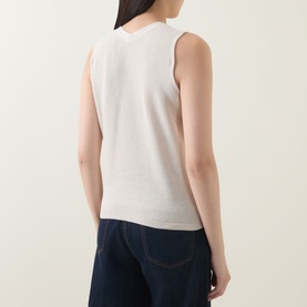 Model wearing InWear Deva Knitted Vest in Ecru, back view, sleeveless knit with ribbed trims, styled with dark navy trousers.