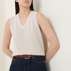Model wearing InWear Deva Knitted Vest in Ecru with V-neckline and sleeveless design, styled with dark denim jeans and tan belt.