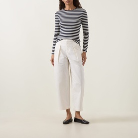 Model wearing InWear Elvia Wide Leg Trousers in Vanilla with pleat detail, styled with a navy striped top and black ballet flats.