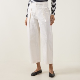 Model wearing InWear Elvia Wide Leg Trousers in Vanilla with pleat details, styled with a striped top and black ballet flats.