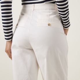 Model wearing InWear Elvia Wide Leg Trousers in Vanilla with gold-tone buttons and rear jet pockets, styled with a navy striped long-sleeve top.