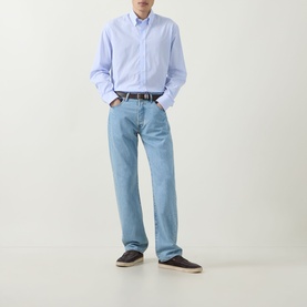 Model wearing Kempt Blue White Stripe Single-Cuff Shirt with button-down collar, styled with light wash jeans and dark loafers.