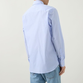 Model wearing Kempt Stripe Single-Cuff Shirt in blue and white, rear view showing straight yoke, curved hem and single cuffs. Styled with light blue