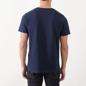 Model wearing Levi's Original Housemark Logo T-Shirt in blue, crew neck, short sleeves, rear view, styled with dark denim jeans.