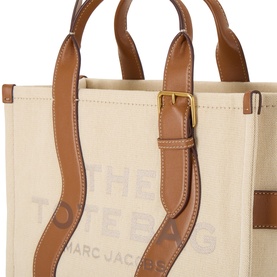 Marc Jacobs The Wavy Canvas Medium Tote Bag in beige, tan leather trims with gold buckle hardware, wavy contrast detailing and shoulder strap