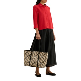Model wearing Hobbs salsa red shirt with black midi skirt and black ballet flats, carrying a beige checked tote bag.