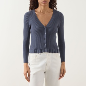 Model wearing Paige Pacific Blue ribbed cardigan with V-neck, button front and peplum hem, styled with white jeans.