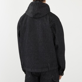 Model wearing Robyn Lynch black denim casual jacket, rear view, with attached hood and relaxed fit, styled with matching black trousers.