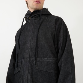 Model wearing Robyn Lynch black denim casual jacket with hood, drawstring detail, and large chest patch pocket visible.