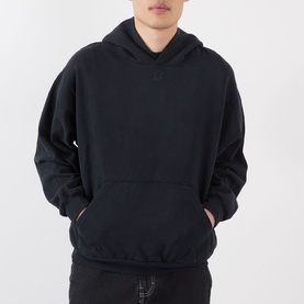 Model wearing Robyn Lynch Ireland Logo Embroidered Hoodie in slate blue with kangaroo pocket, dropped shoulders, and ribbed trims, styled with dark