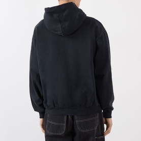 Model wearing Robyn Lynch Ireland Logo Embroidered Hoodie in slate blue, back view, with navy contrast-stitch trousers.