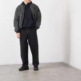 Model wearing Robyn Lynch Ireland Logo Embroidered Hoodie in slate blue, styled with dark bomber jacket, black tapered trousers and black shoes.