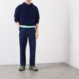 Model wearing Robyn Lynch Ireland Logo Embroidered Polar Fleece Hoodie in navy, styled with matching navy trousers and grey trainers.
