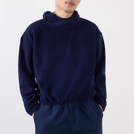 Model wearing Robyn Lynch Ireland Logo Embroidered Polar Fleece Hoodie in navy, with high neck, dropped shoulders and elasticated hem. Styled with