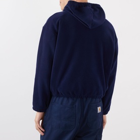 Model wearing Robyn Lynch Ireland Logo Embroidered Polar Fleece Hoodie in navy, rear view, styled with navy trousers.