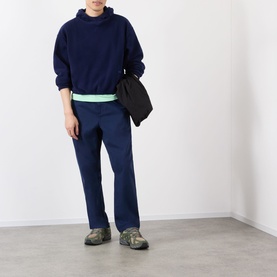 Model wearing Robyn Lynch Ireland Logo Embroidered Polar Fleece Hoodie in navy, styled with matching navy trousers, crossbody bag and hiking shoes.