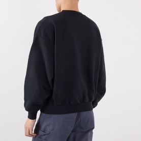 Model wearing Robyn Lynch off black polyester sweatshirt, rear view showing relaxed fit with ribbed cuffs and hem