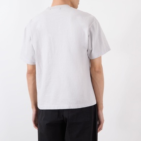 Model wearing Robyn Lynch grey cotton T-shirt, rear view, styled with black trousers.