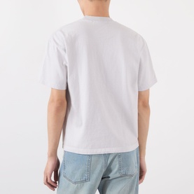 Model wearing Robyn Lynch grey cotton T-shirt, back view, styled with light blue denim jeans.