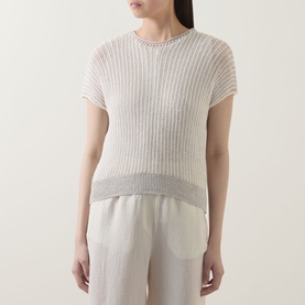 Model wearing Transit white/sand ribbed knit cotton-linen top with short sleeves and contrast hem, styled with cream wide-leg trousers